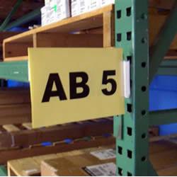Slip-N-Stik Aisle Sign Kit snaps into pallet rack assembly holes - Just snap out to relocate. Whether a warehouse, library or store room, sign posting starts in the aisle and there is no better system than the Slip 'N Stik Aisle Sign Kit.